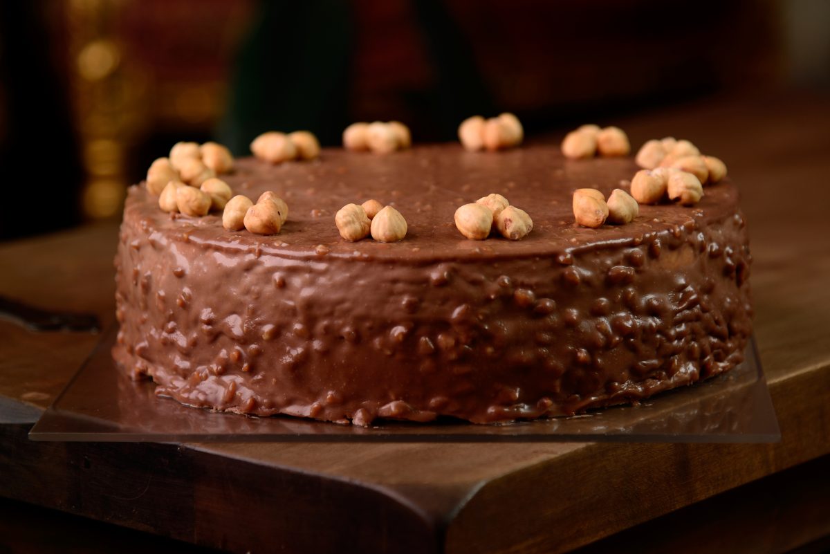 Hazelnut chocolate cake macro of hazelnut on wooden table