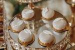 A tray of desserts with a leaf design on top