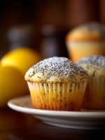 Close Up of Delicious Lemon Poppy Seed Muffins Sprinkled with Powdered Sugar.