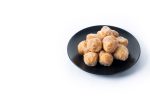 Traditional Carnival fritters or buñuelos e viento isolated on white background. .