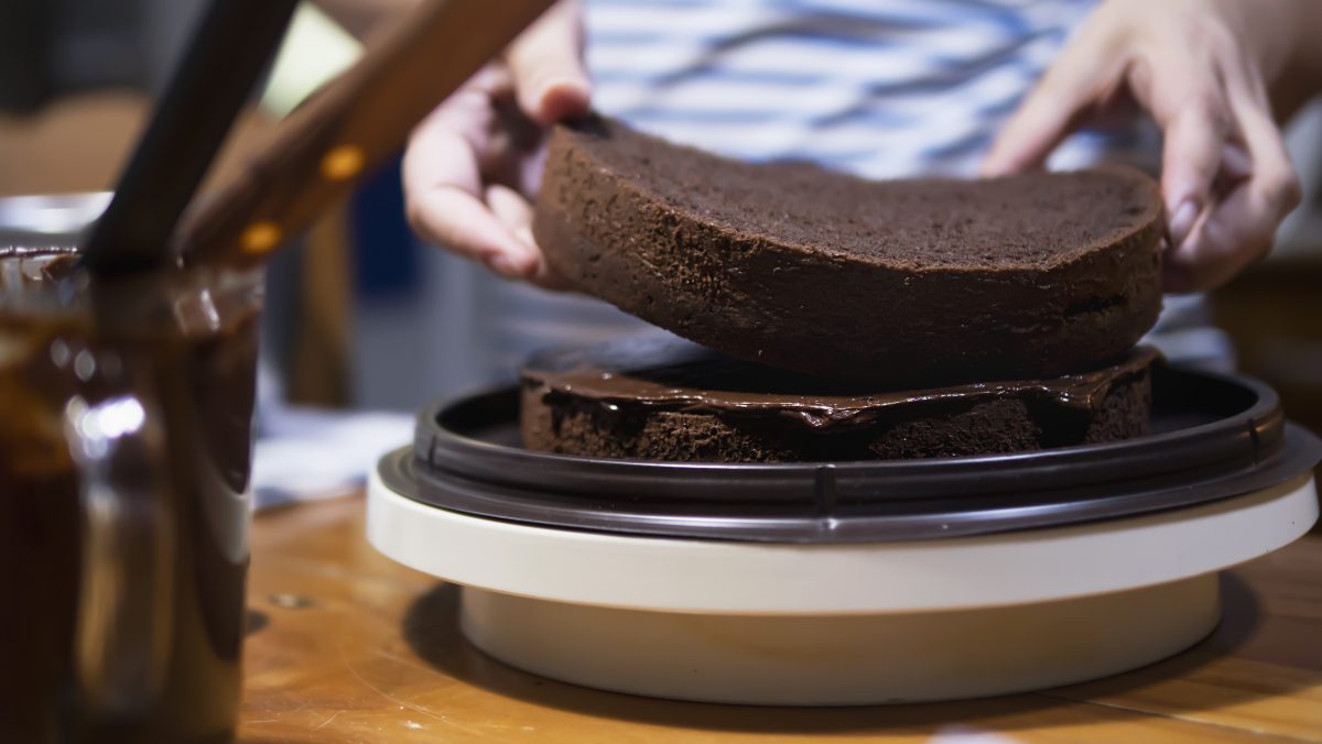 Lady making chocolate cake people with home made bakery concept