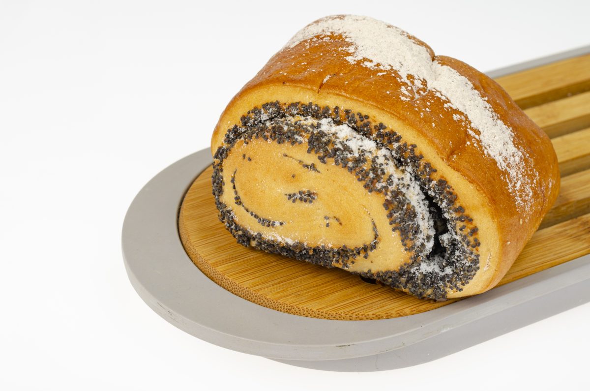 Fresh delicious homemade pastries, poppy seed bun. Studio Photo
