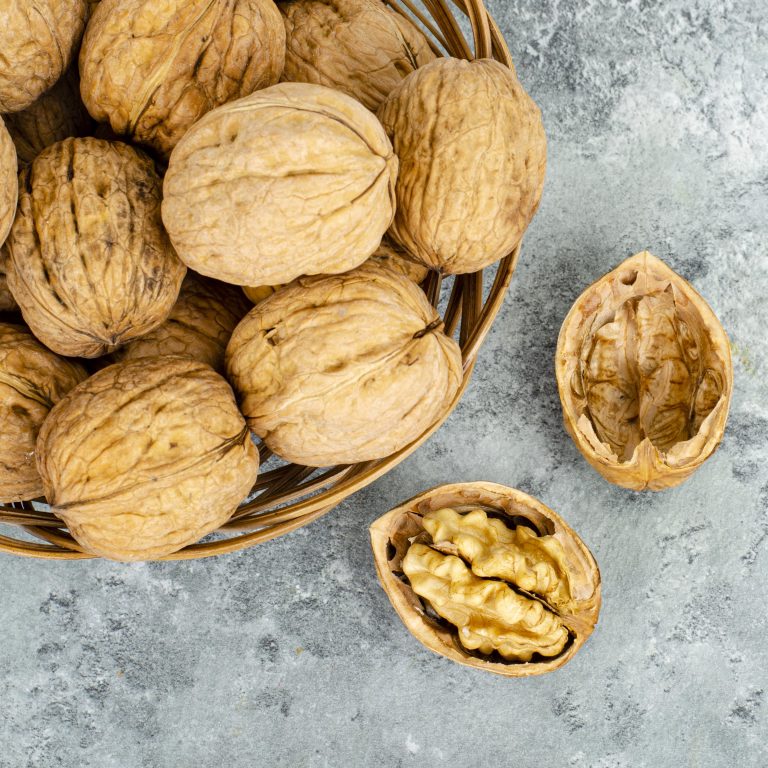 tasty Unpeeled walnuts, background, texture. Studio Photo