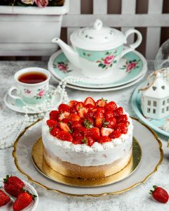 strawberry cheesecake with lots of strawberries on top
