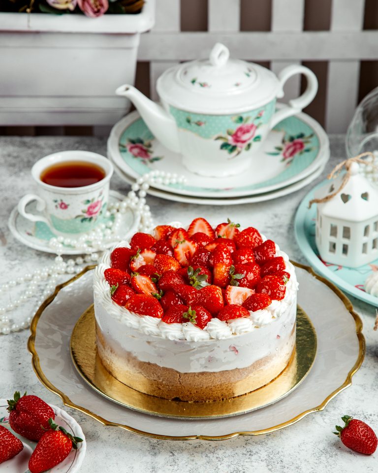 strawberry cheesecake with lots of strawberries on top