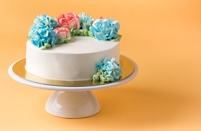 butter cake on cake stand and yellow background