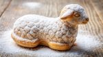 close up, religious,easter, A close up image of a delectable lamb shaped sweet Easter pastry covered in powdered sugar creating a stunning panoramic view of a festive dessert