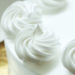 Close up of whipping cream cake decoration.