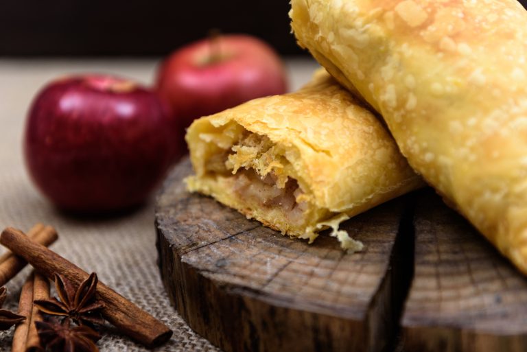 Apple strudel on wooden end of a tree